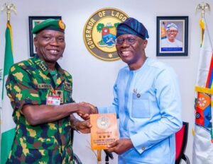 l-r: Chief of Army Staff, Lieutenant General Taoreed Lagbaja presents a complimentary plaque to Governor of Lagos State, Mr. Babajide Sanwo-Olu during a courtesy call to the governor at the Lagos House, Marina